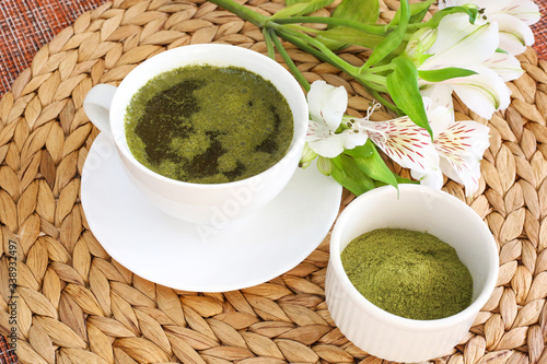 Green powder tea super food. Moringa green tea. Healthy lifestyle.