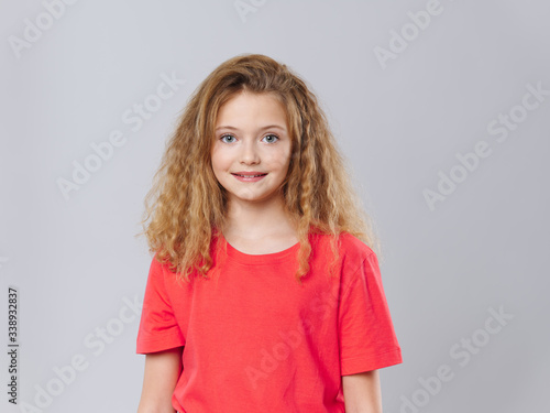 cheerful girl curly hair smile studio lifestyle gray background