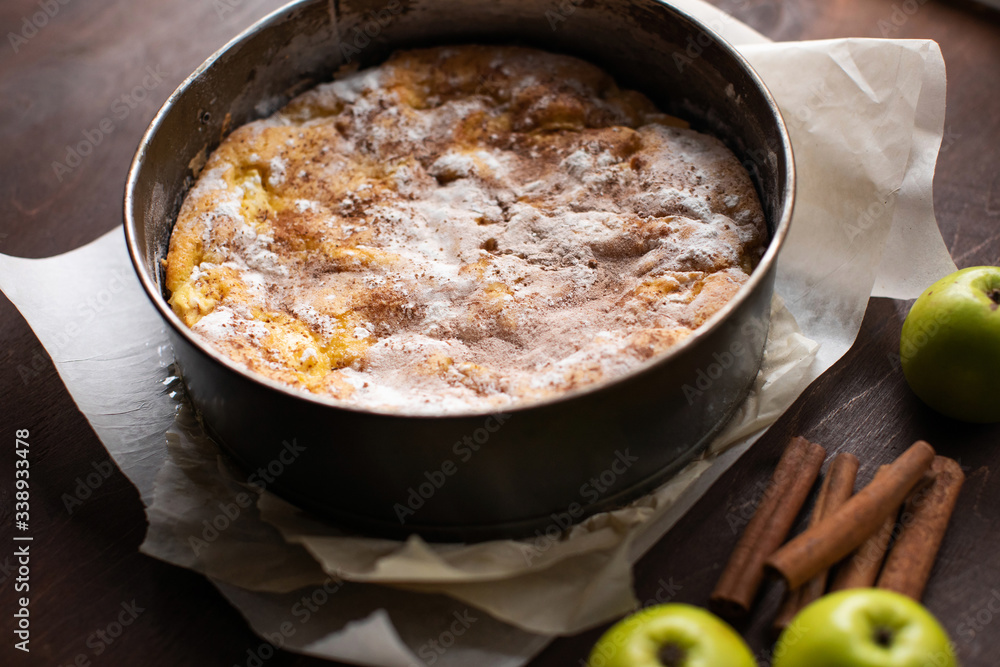 Homemade apple pie in baking form on the kitchen Homemade apple pie in baking form on the kitchen