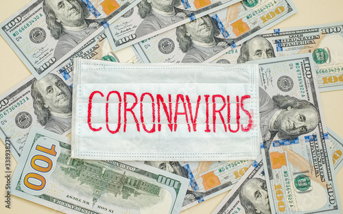 Medical protective mask with the inscription Coronavirus is on the American dollars.