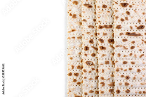 Matzah. Jewish traditional Passover bread. Pesach celebration symbol. Isolated on white. With some free space for your text or sign . Close-up.