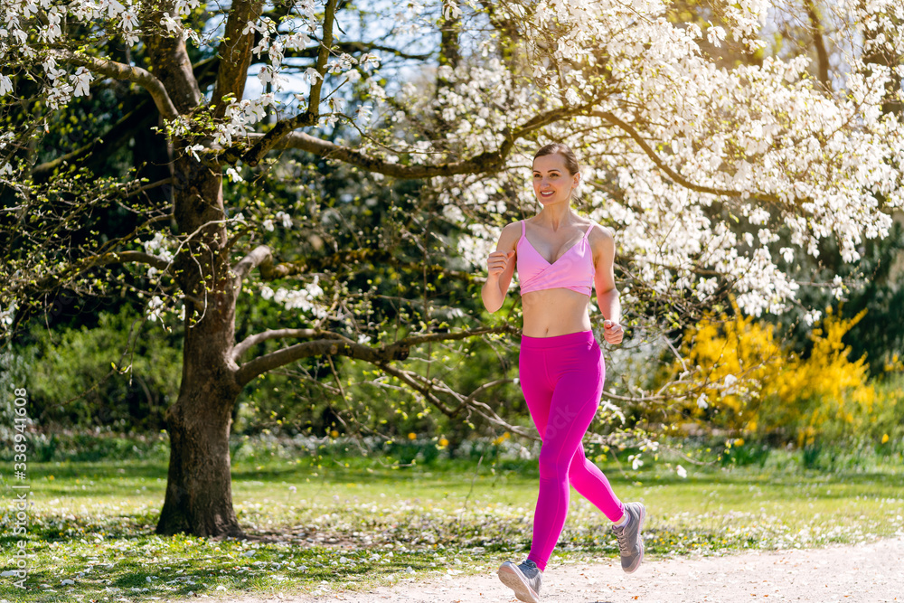 Woman running in spring park Woman running in spring park