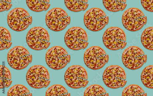 round pizza with a cut piece on a blue background pattern
