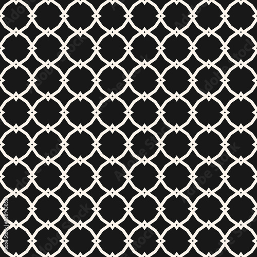 Vector ornamental seamless pattern with carved grid, lattice, mesh, net, repeat geometric tiles. Black and white ornament in Moroccan style. Simple abstract background texture. Elegant dark design