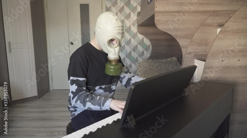 Virus gas mask boy plays piano