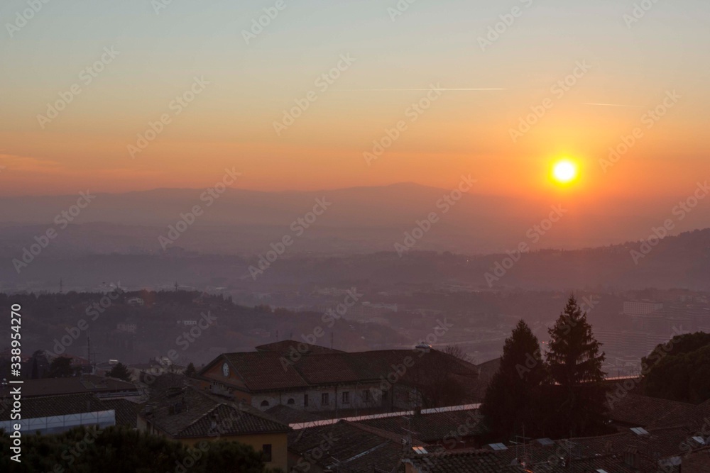 Sunset through umbrian hills from Perugia city