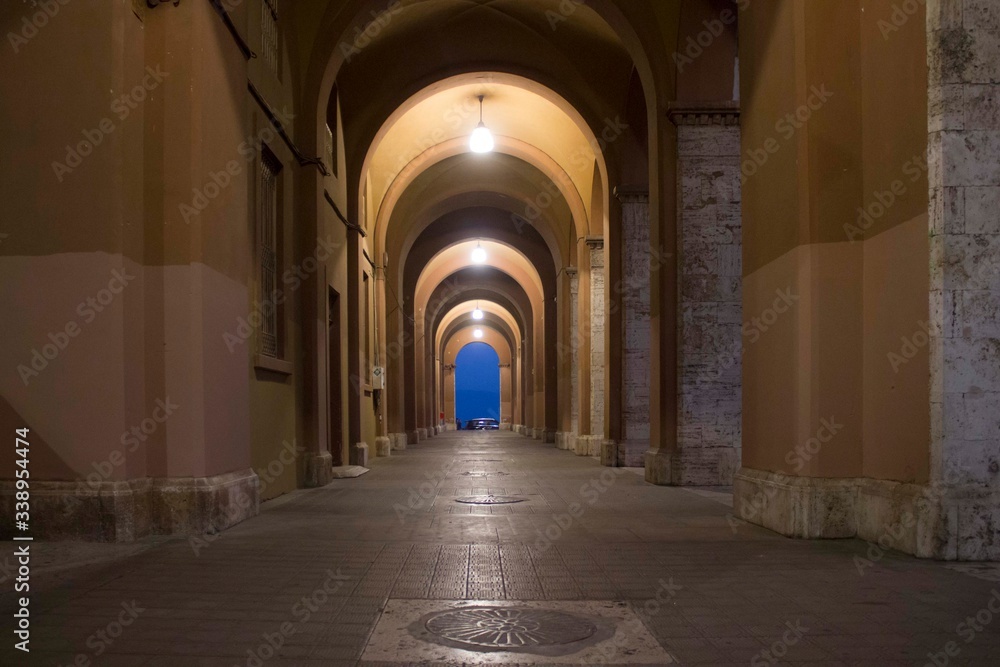 Obraz premium Night view of an historic porch in the cityof Perugia, Italy