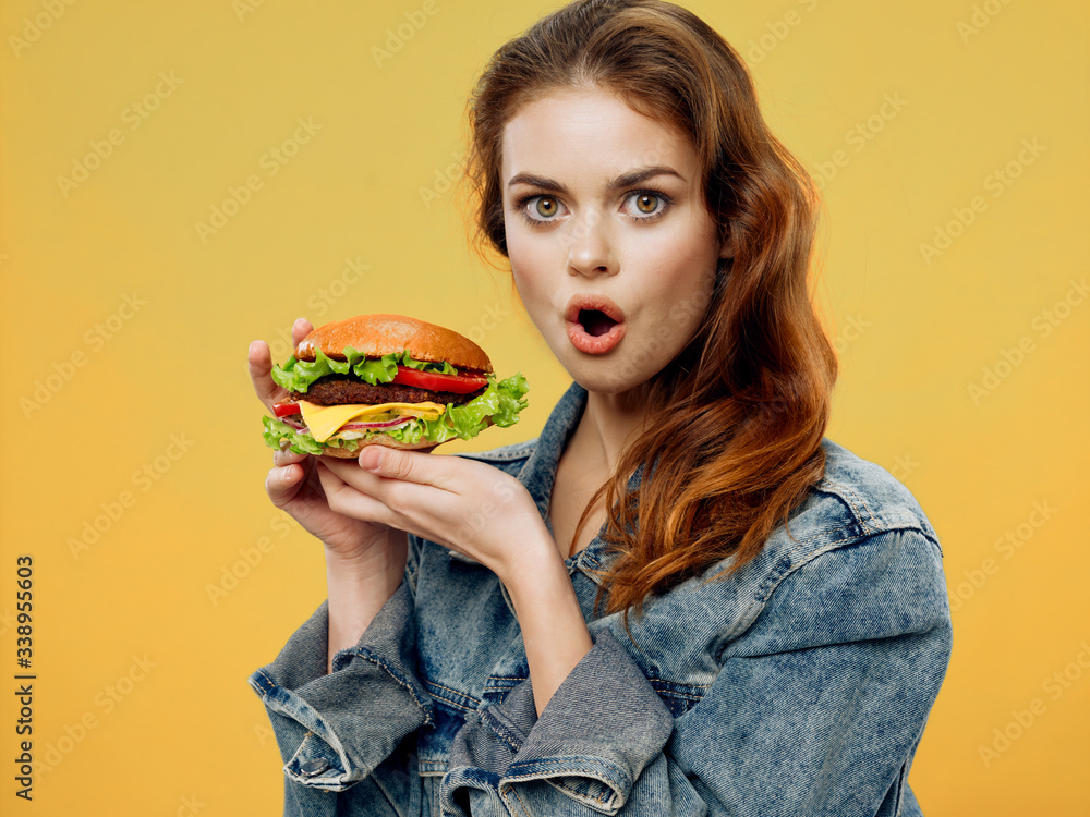 Cheerful woman hamburger fast food meal restaurant delivery Cheerful woman hamburger fast food meal restaurant delivery