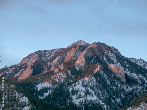 Boulder snow-kissed Flatirons