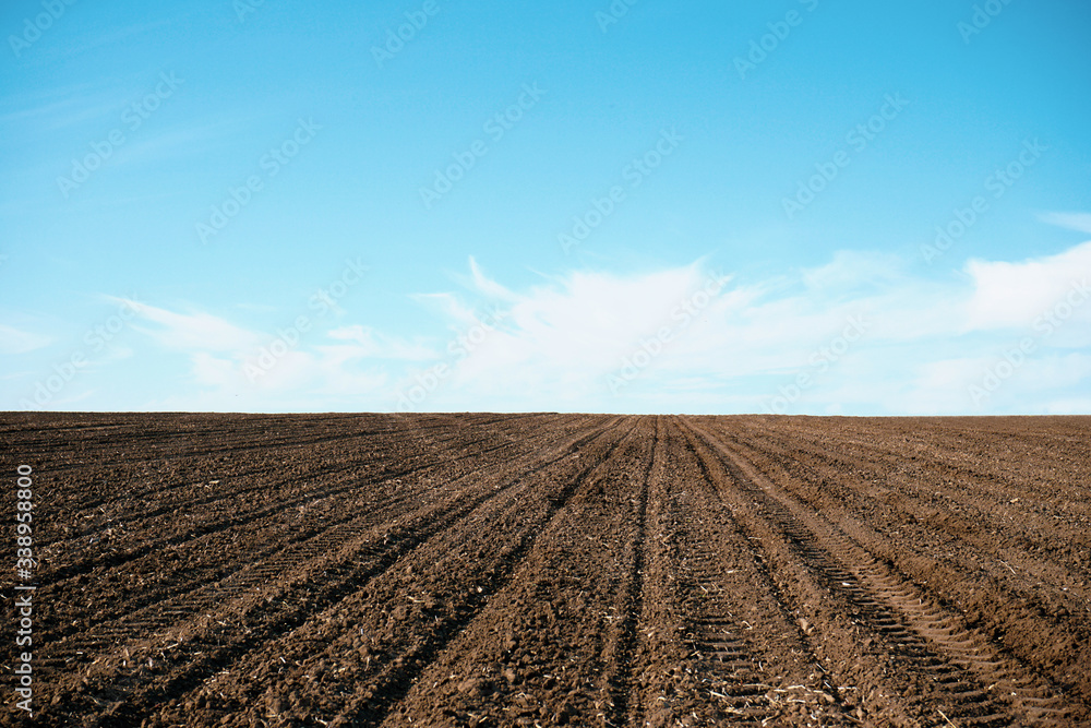 Plowed soil. Agricultural rural background. Plowed field in early spring. Plowed soil. Agricultural rural background. Plowed field in early spring.