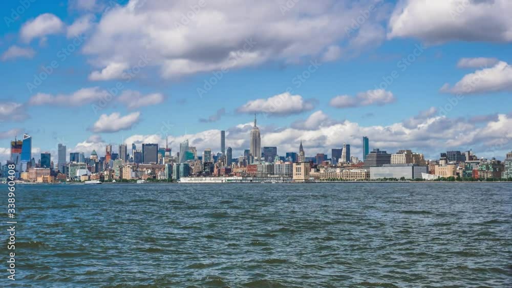 A large body of water with a city in the background A large body of water with a city in the background