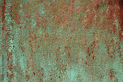 Texture with covered paint. Green background with rust