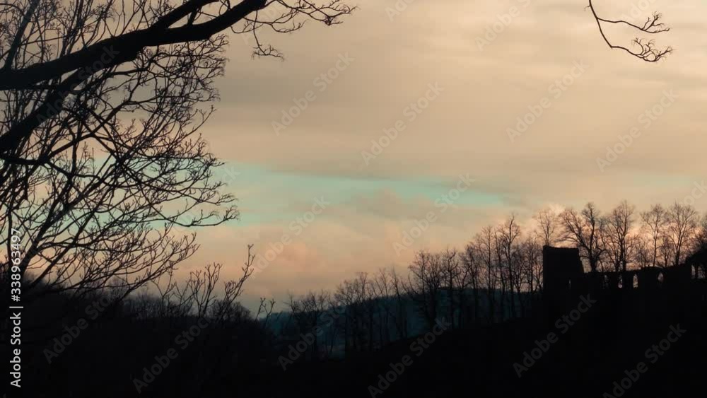 ruined fortress on a hill at sunset ruined fortress on a hill at sunset