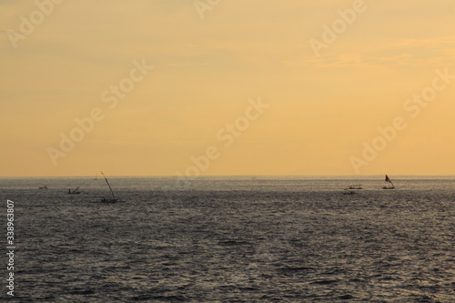 Fishing boats at sunset, traveling Bali Indonesia © Raul Baldean