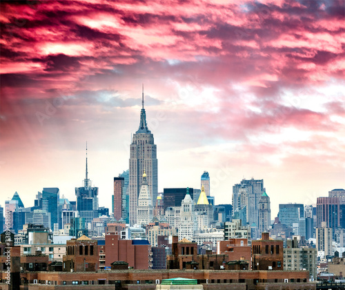 Amazing sunset skyline of Midtown Manhattan on a cloudy autumn afternoon  New York City  USA