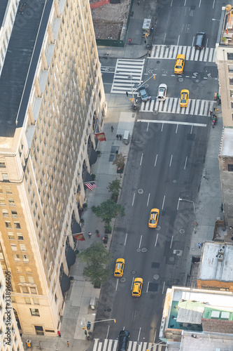 Photography Yellow cabs traffic along a major Manhattan Avenue, overhead aerial view, New Yo
