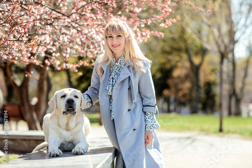 Blonde girl with a white dog