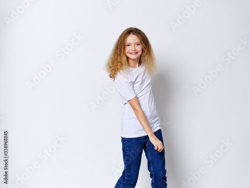 Girl in a white T-shirt jeans model