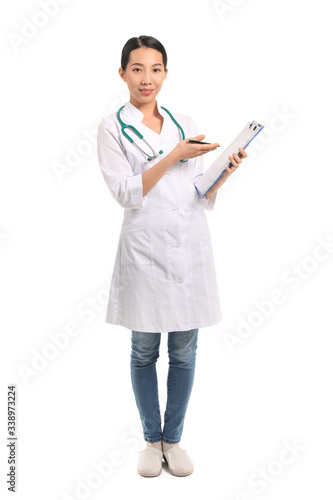 Female Asian doctor with clipboard on white background