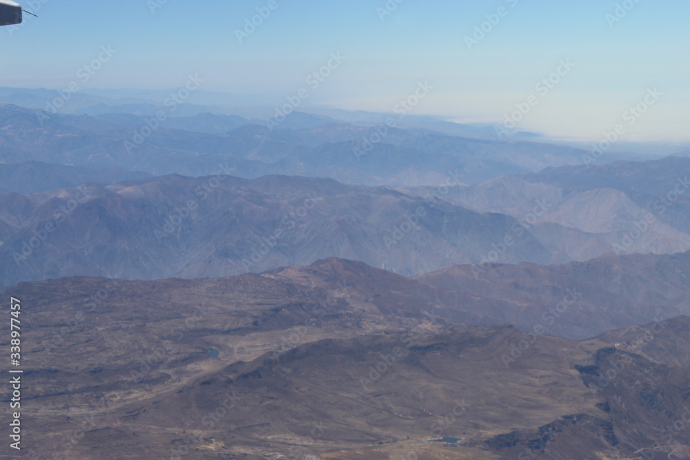 the view of peruvian mountains and jungle from the airplane 