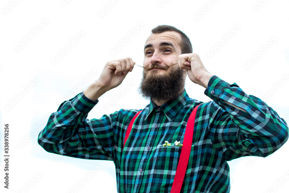 Lovely young man with beard and mustache on a white background. Lovely young man with beard and mustache on a white background.
