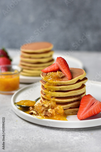  gluten free pancakes with lemon jam on a white craft plate. family Breakfast dish, food for children in the morning.  pancakes recipe . food delivery