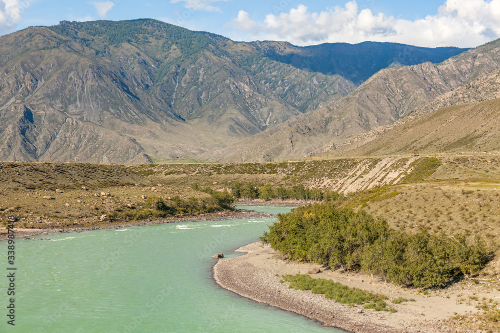 White mountain river in Altai. Summer View of Altai, Russia. Altai Republic is one of Russia's ethnic republics. Altay White mountain river in Altai. Summer View of Altai, Russia. Altai Republic is one of Russia's ethnic republics. Altay