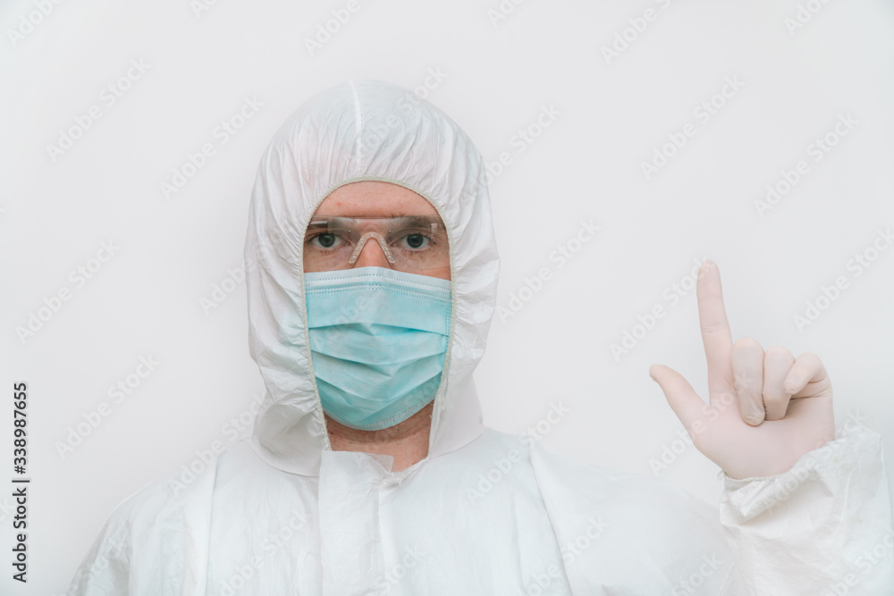 Portrait of a specialist in blue respirator and protective coverall Portrait of a specialist in blue respirator and protective coverall
