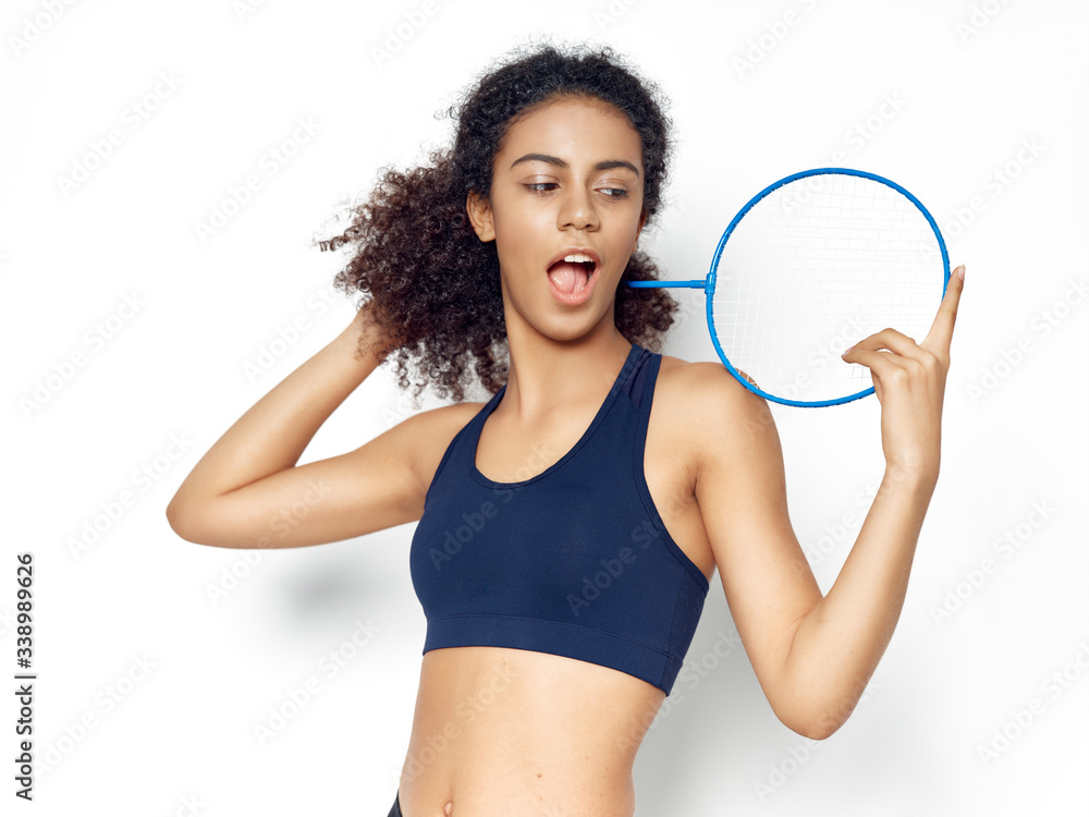 young woman holding a tennis racket young woman holding a tennis racket