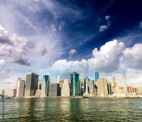 Lower Manhattan buildings and East River reflections, New York City, USA