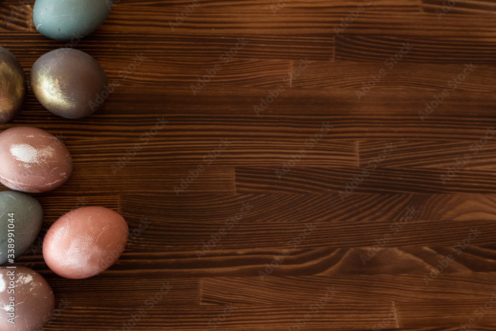 Happy easter egg. set of Holiday eggs on brown wooden backround, copy space. Natural colorful eggs painted in pastel colors , happy Easter concept. Happy easter egg. set of Holiday eggs on brown wooden backround, copy space. Natural colorful eggs painted in pastel colors , happy Easter concept.