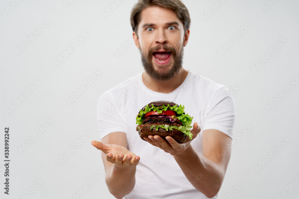 Cheerful man hamburger fast food meal diet snack restaurant Cheerful man hamburger fast food meal diet snack restaurant