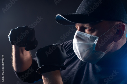 A man in black rubber glove...