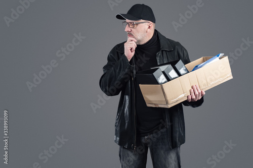 A confused man in black clo...
