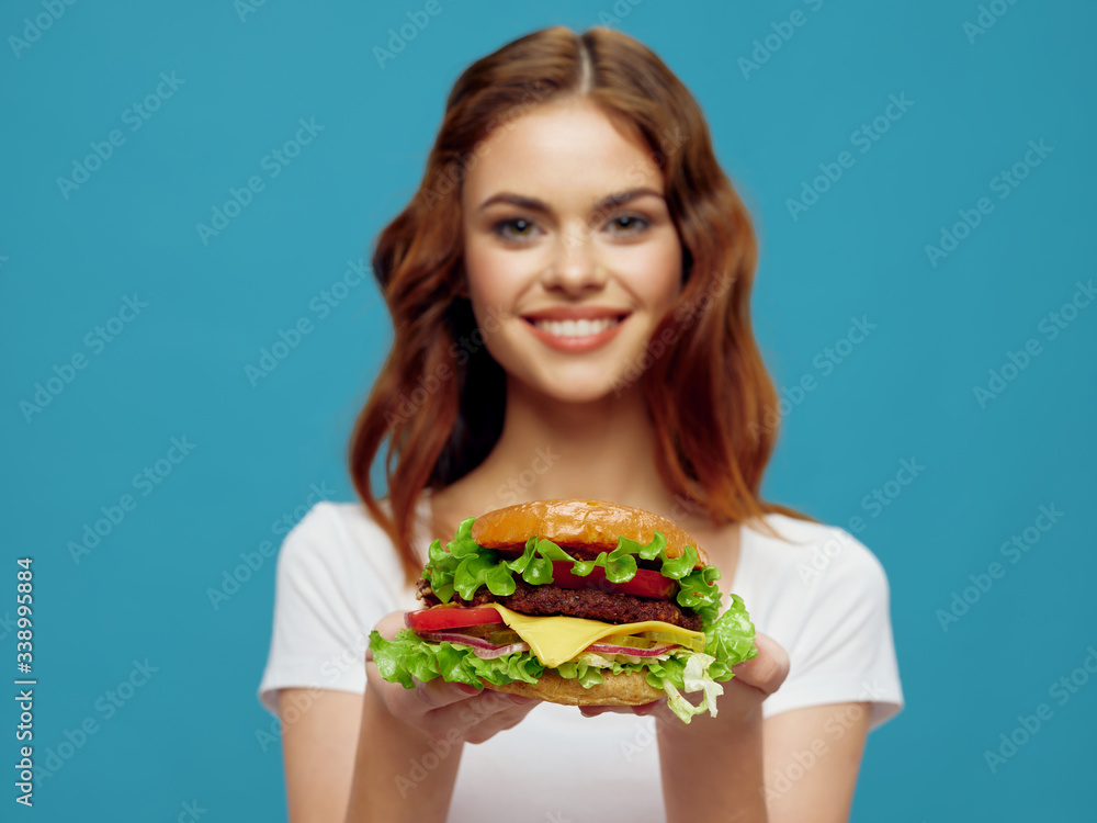 Cheerful woman hamburger fast food meal gourmet restaurant