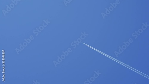 blue sky and airplane moving high photo