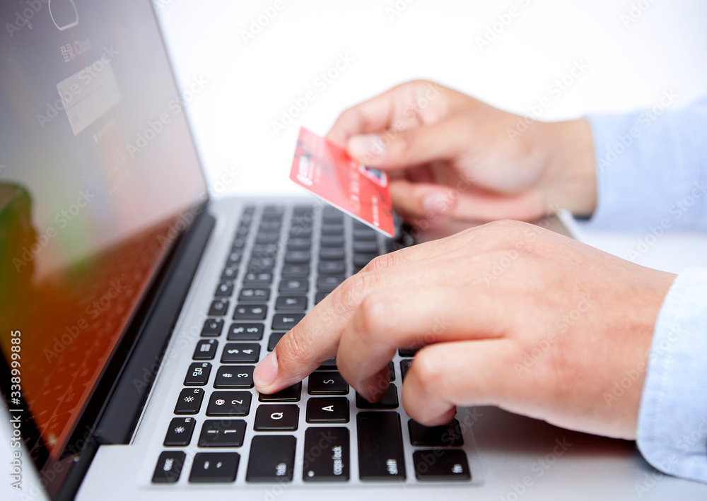 Hands with keyboard and credit card Hands with keyboard and credit card