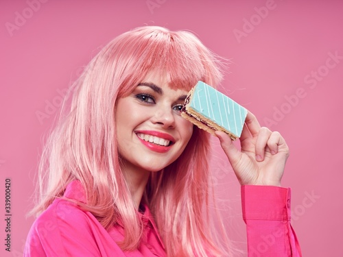 Cheerful woman pink hair cake enjoyment joy