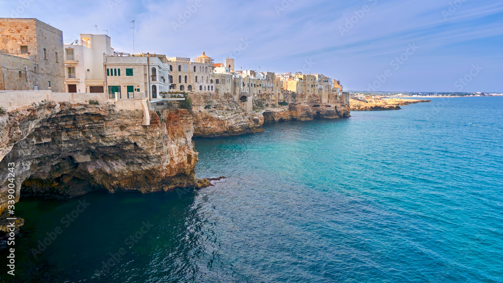 Houses on dramatic cliffs over Adriatic Sea On A Sunny Autumn Day At Polignano a Mare- Apulia - Italy