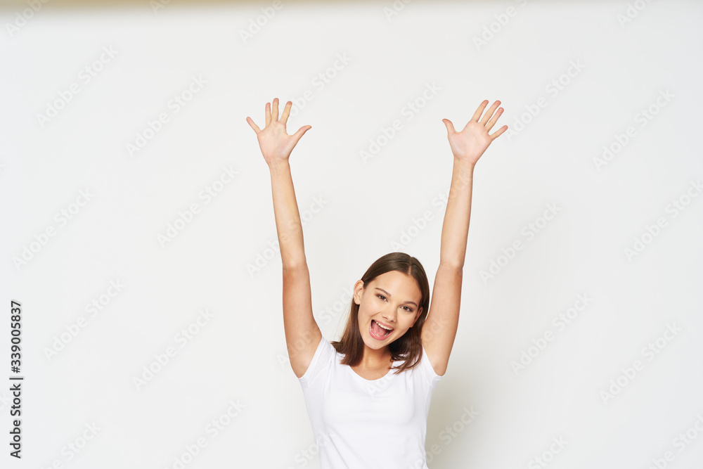 young woman with arms raised