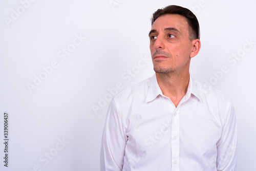 Mature handsome Italian businessman against white background © Ranta Images