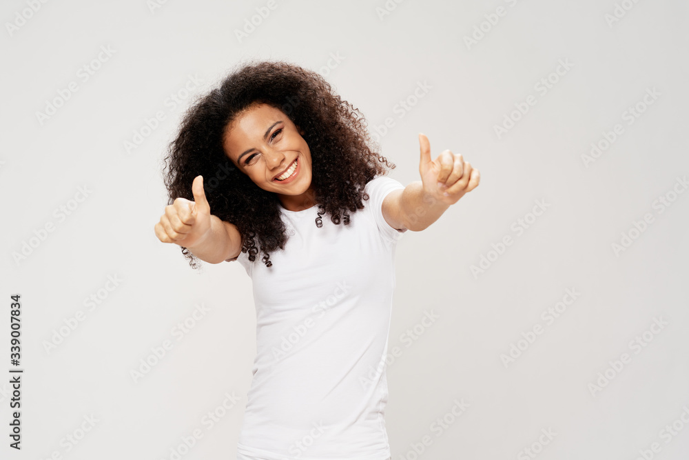 happy young woman showing thumbs up happy young woman showing thumbs up
