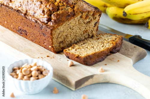 Tableau sur toile Freshly baked butterscotch chip banana bread, sliced into and ready for eating