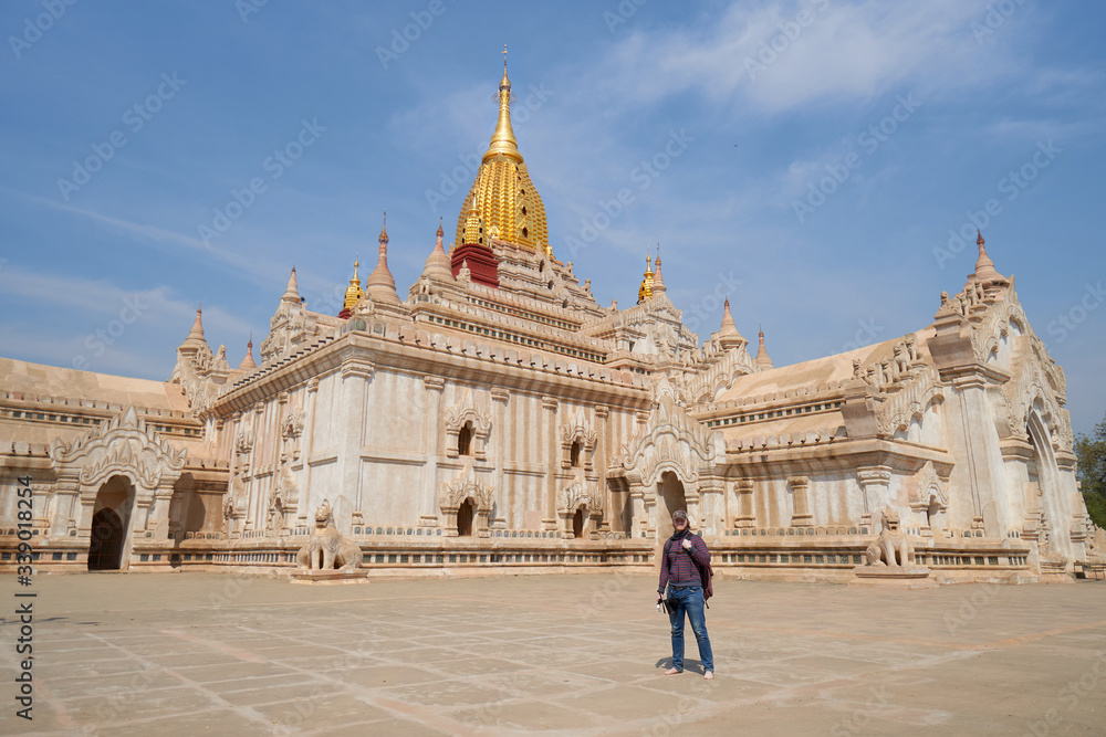 Traveler visited the beautiful Ananda temple with a golden dome during his vacation in old Bagan, Myanmar, Burma, South East Asia.