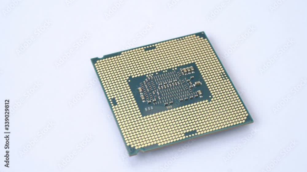 The modern CPU is a chip that is spinning on a white background. The modern CPU is a chip that is spinning on a white background.