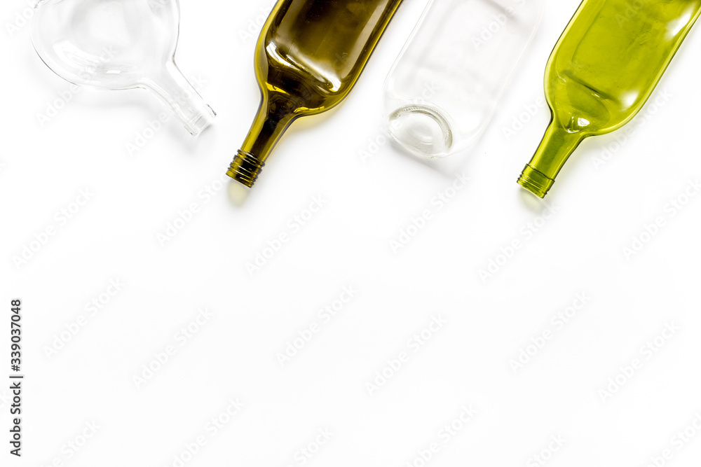 Flat lay with bottles on white table top-down copy space Flat lay with bottles on white table top-down copy space