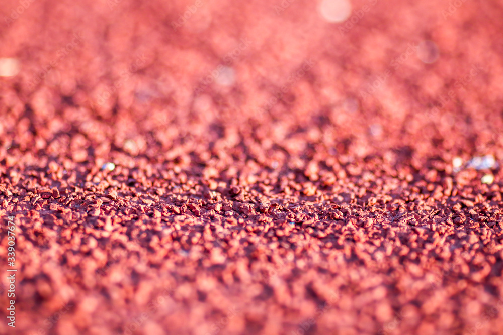 Red running sport track background and texture. Sport running track concept. Red running sport track background and texture. Sport running track concept.