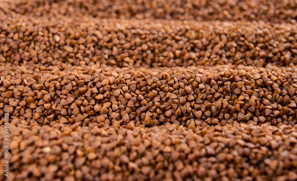 A pile of buckwheat. Buckwheat harvest. Buckwheat grain. A pile of buckwheat. Buckwheat harvest. Buckwheat grain.