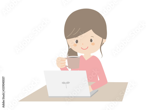 Woman drinking coffee while looking at the computer.