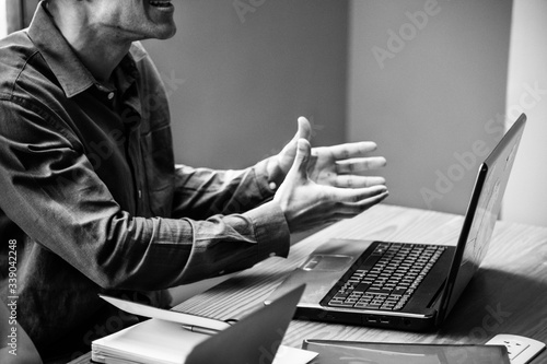 Valokuva Businessman trying to convince his team